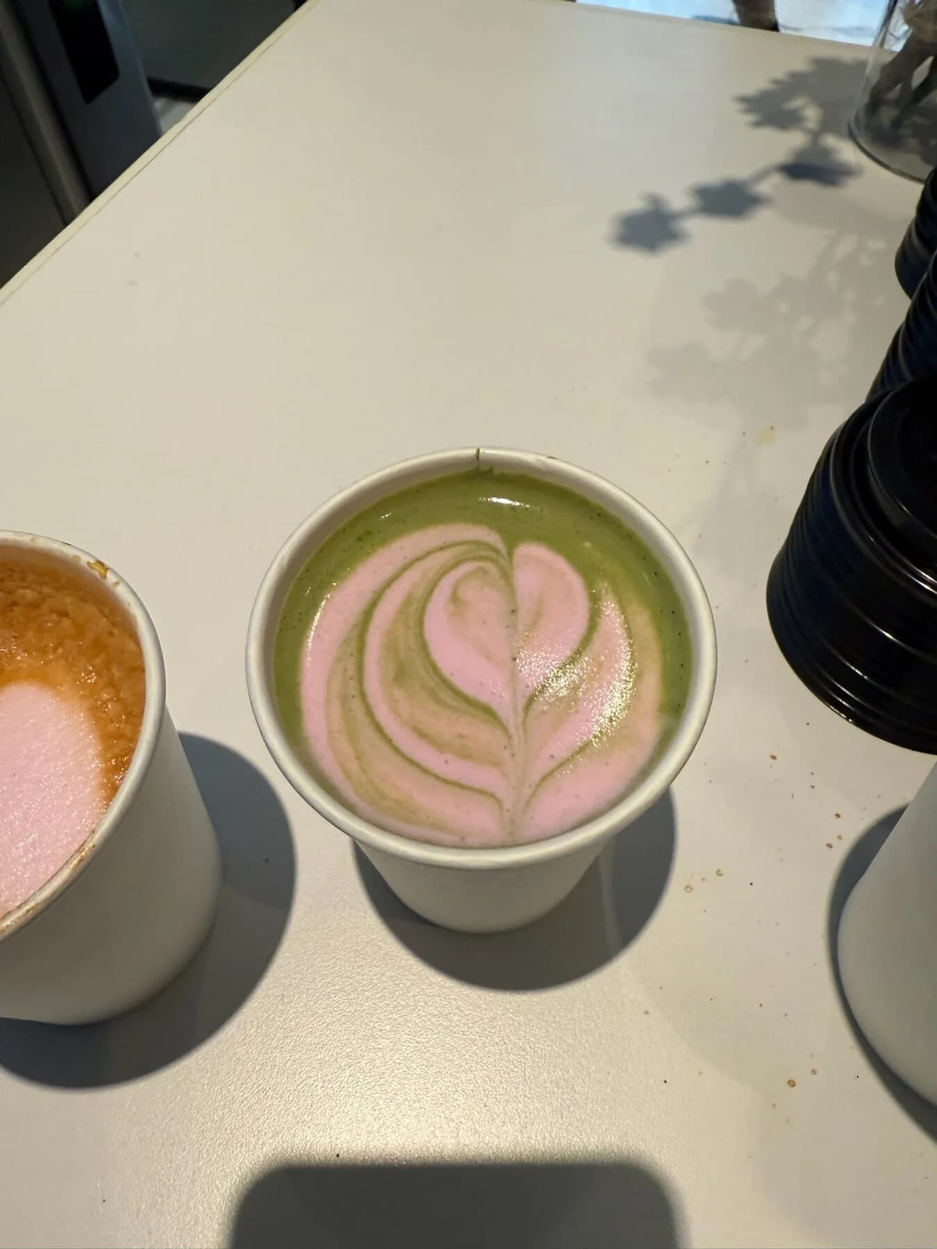 Matcha latte with detailed rosetta latte art served at a company staff appreciation event